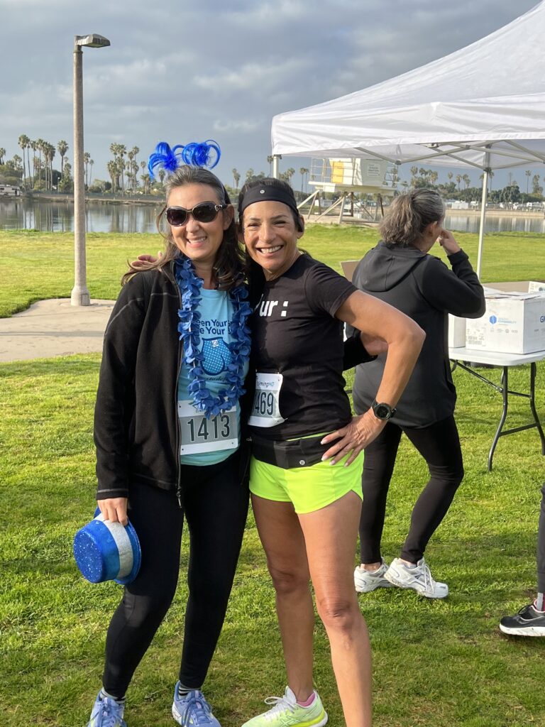 Two Women Participants Demonstrating That The Day Called for Some Bling - Sporting Costume Attire