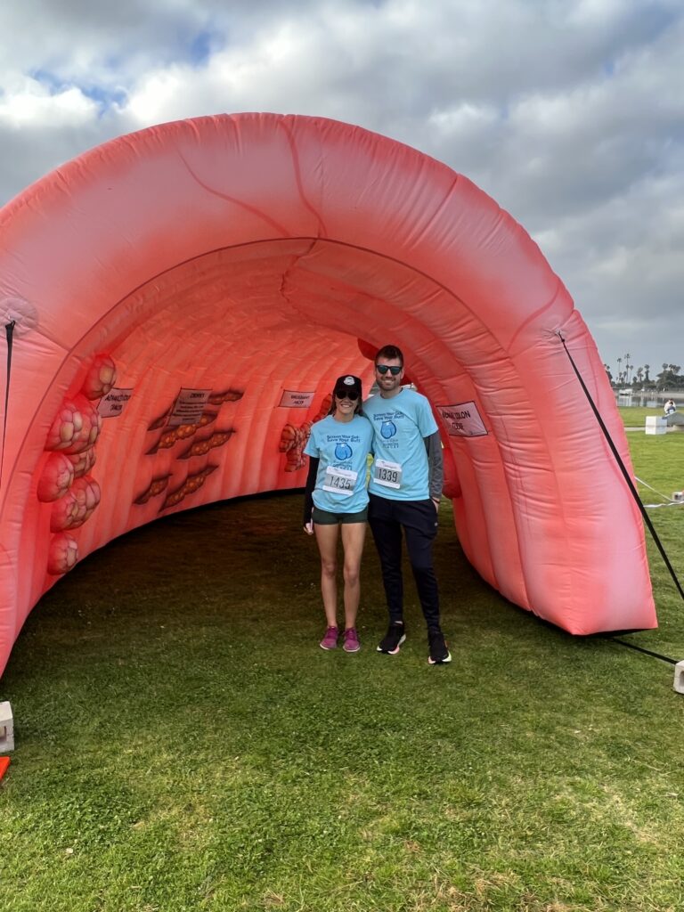 Two People Standing In the Inflatable Colon