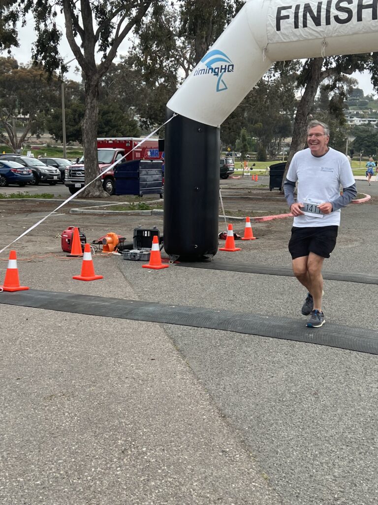 Man Who Helped UCSD Have the Largest Team at the Event - Crossing the Finish Line.