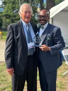 Two Men Celebrating An Award